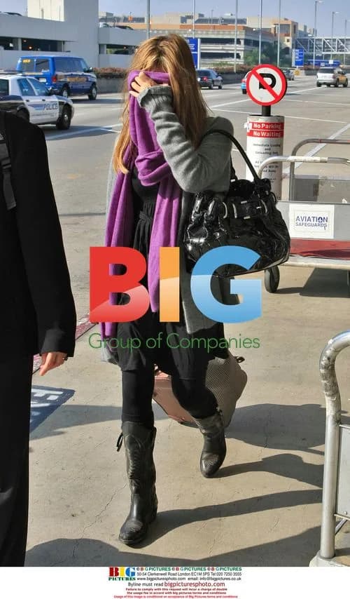 Jessica Alba Arrives at LAX in Scarf and Boots