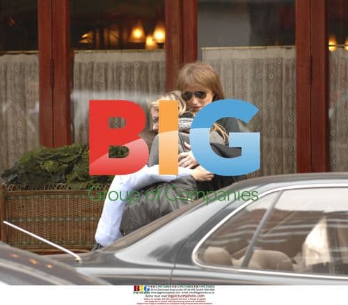 Cecilia Sarkozy hugs children after lunch