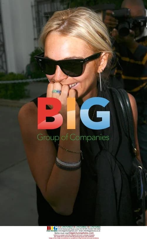 Camera shy Lindsay Lohan attends meeting, goes shopping