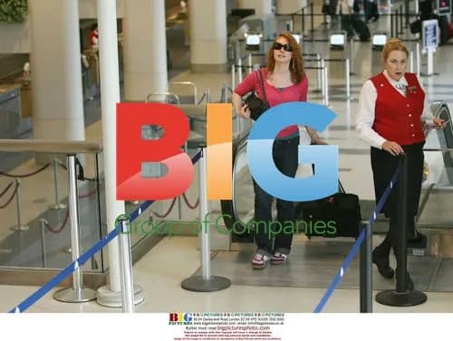 Alicia Witt Departs LAX Flashing Thong