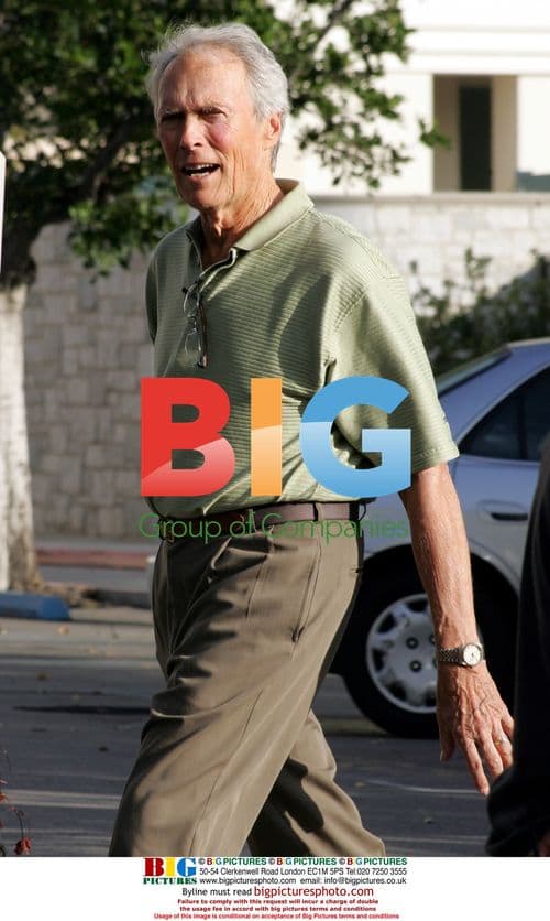 Clint Eastwood Lifting Weights on Film Set