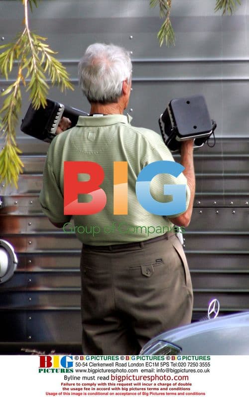 Clint Eastwood Lifting Weights on Set