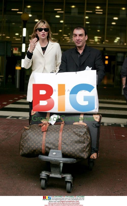 Kate Moss Arrives at Heathrow
