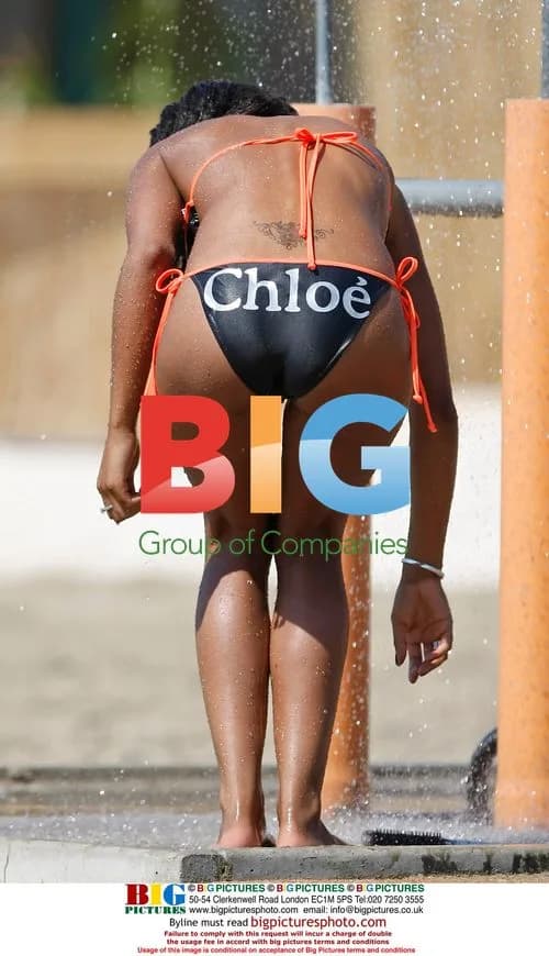 Charley Uchea cools off with shower in Egypt