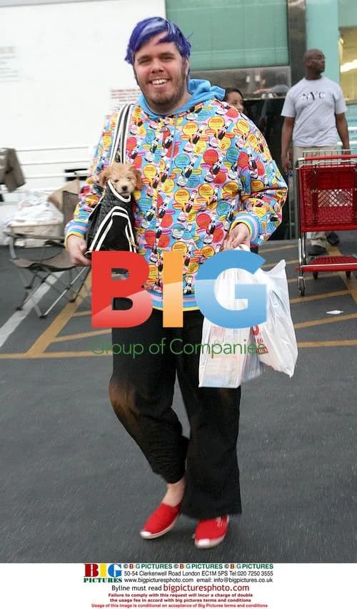 Perez Hilton Leaves Pet Store with Puppy