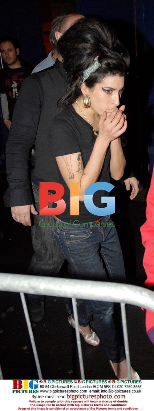 Amy Winehouse Interacts with Fan on Stage