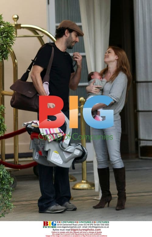 Sacha Baron Cohen and Isla Fisher with Baby Olive