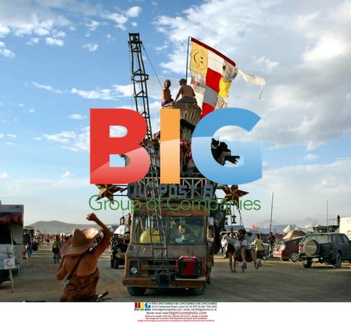 Cyclists and Mutant Vehicle at Burning Man