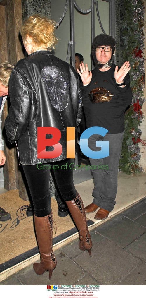 Damien Hirst and Woman with Diamond Skull Sculpture