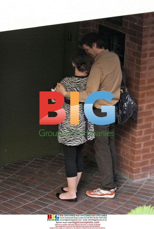 Milla Jovovich & Family Out with Baby