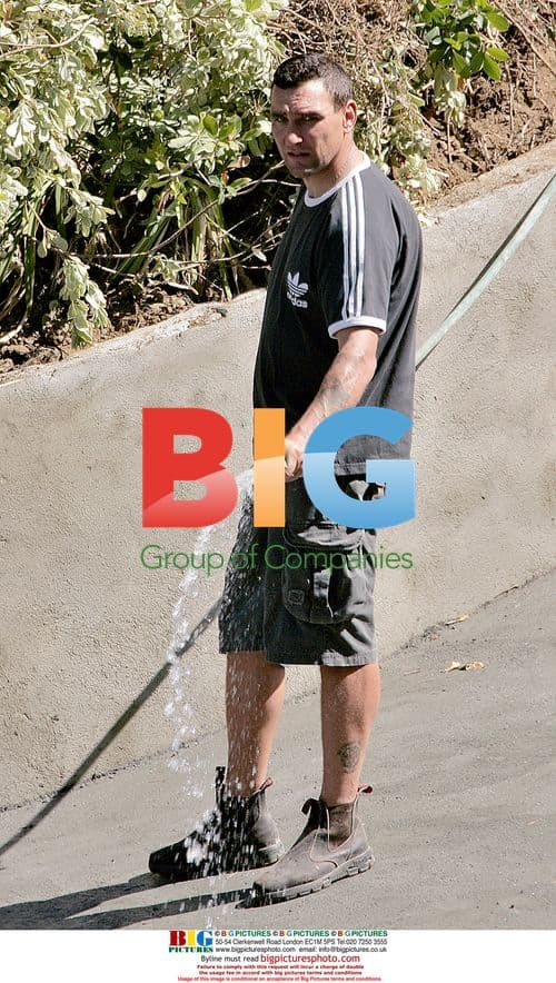 Vinnie Jones waters his LA home