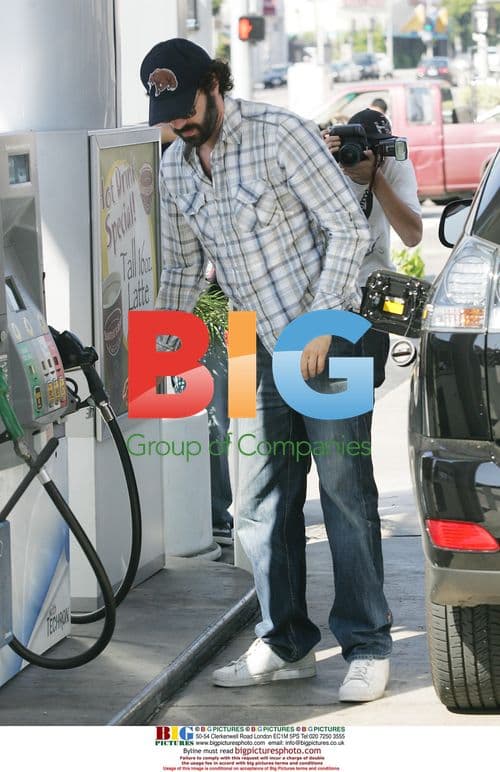 Sacha Baron Cohen and Isla Fisher at Gas Station