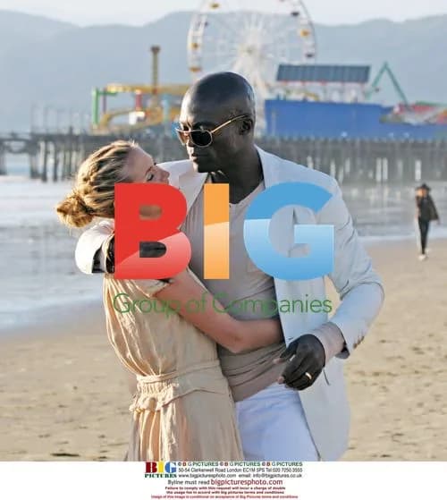 Heidi Klum and Seal Frolic on Beach