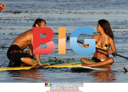 Matthew McConaughey and Camilla Alves Kiss on Paddle Board in Malibu