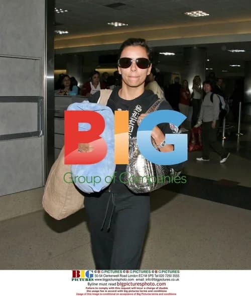 Eva Longoria Arrives at LAX with 'FEED Bag'