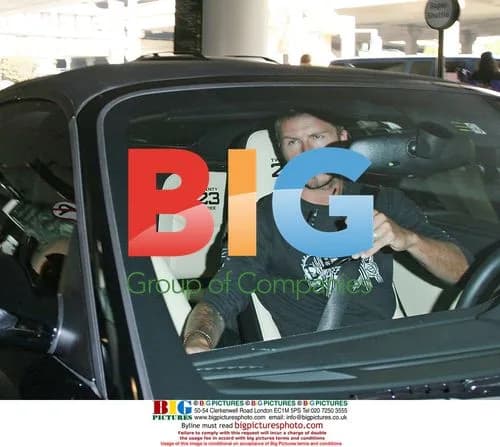 Victoria Beckham Arrives at LAX in Menswear
