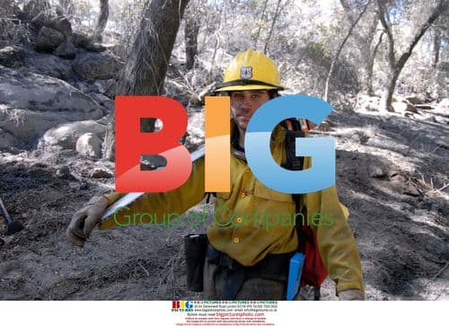 Firefighter Works in Wake of Harris Fire