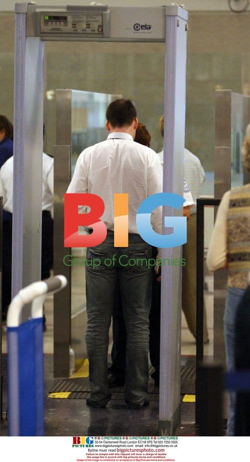 David Furnish Passing Through LAX Security