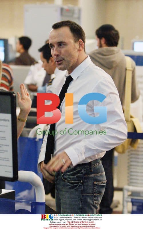 David Furnish Passing Through LAX Security