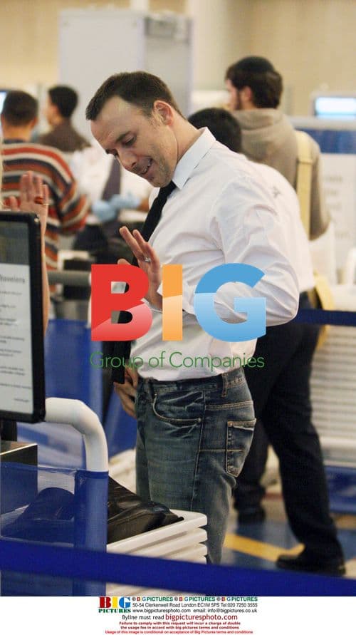 David Furnish passing through LAX security