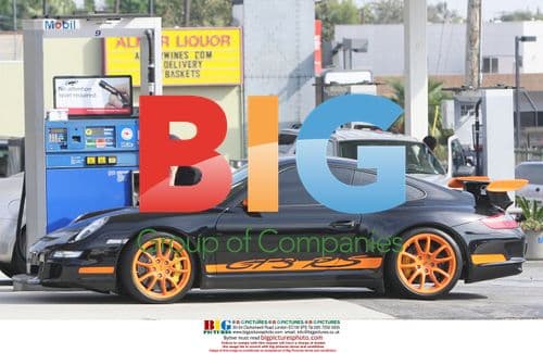 Patrick Dempsey Fuels Up His Orange Porsche