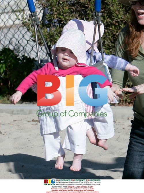 Marcia Cross Plays with Twins in Park