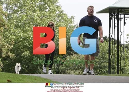 Spice Girl Geri Halliwell exercising with trainer and dog