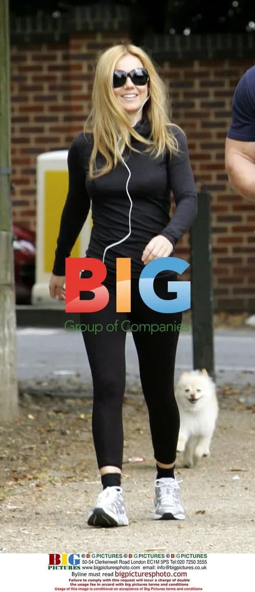 Geri Halliwell and Her Trainer in the Park