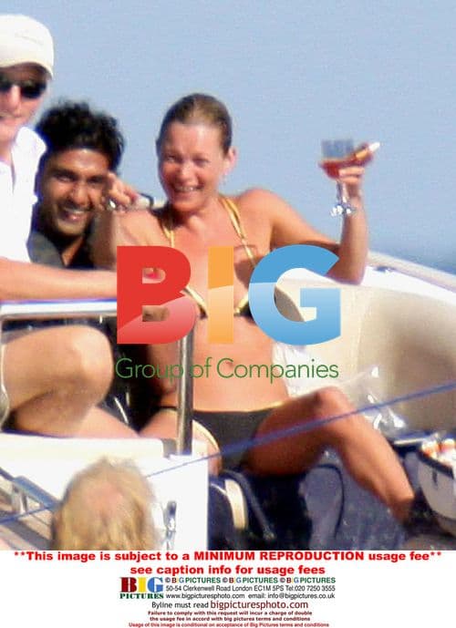 Kate Moss Enjoys Topless Beach Day