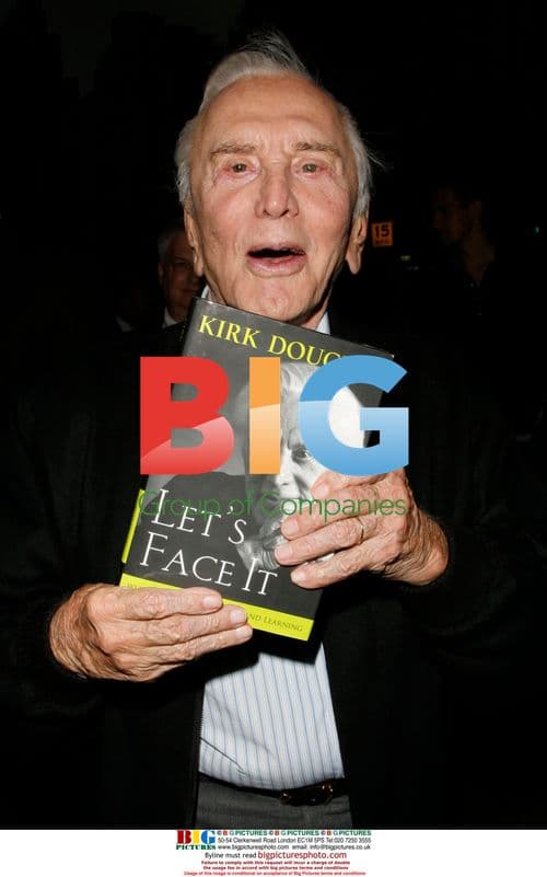 Actor Kirk Douglas signs book