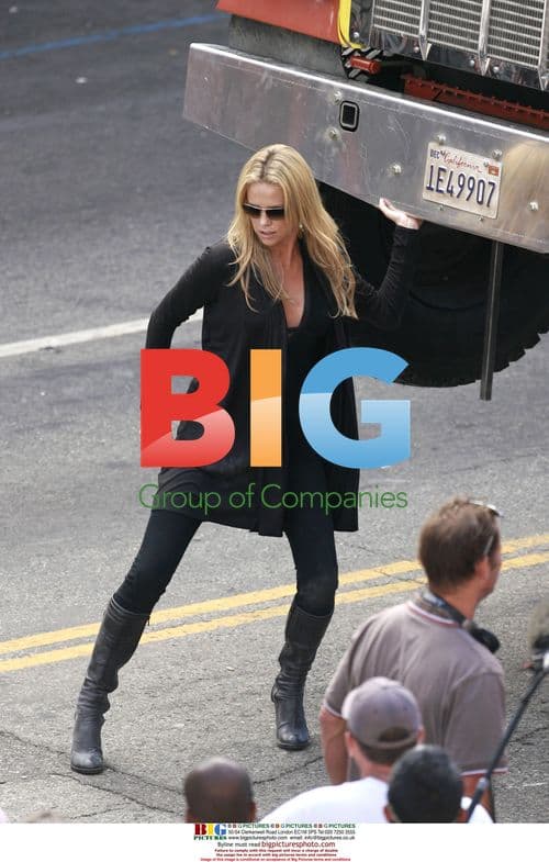 Charlize Theron Lifts Truck for 'John Hancock' Film