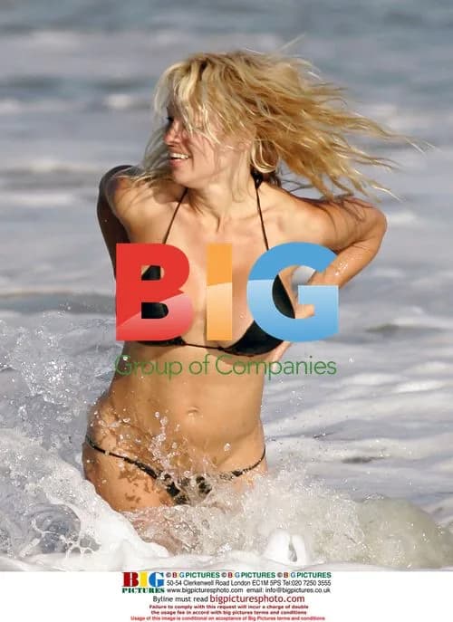 Pam Anderson and Rick Solomon Frolic on Malibu Beach