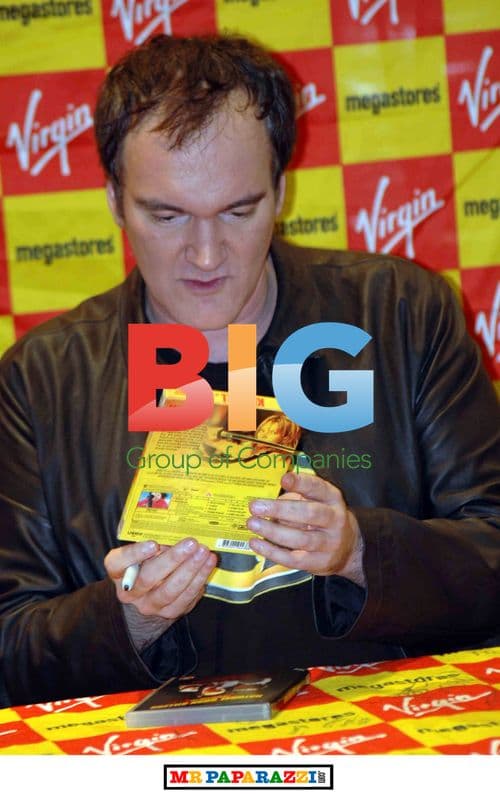 Quentin Tarantino Signs DVDs for Fans