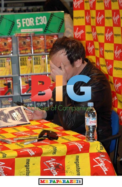 Tarantino Signing DVDs for Fans