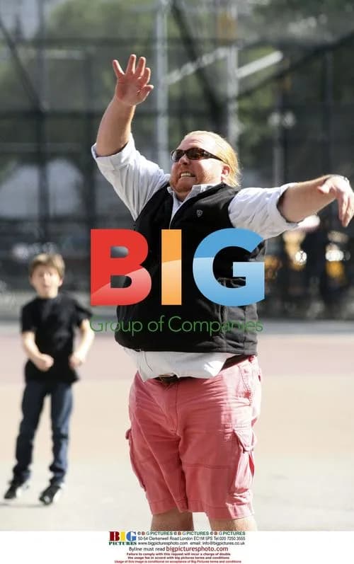 Chef Mario Batali plays football with kids