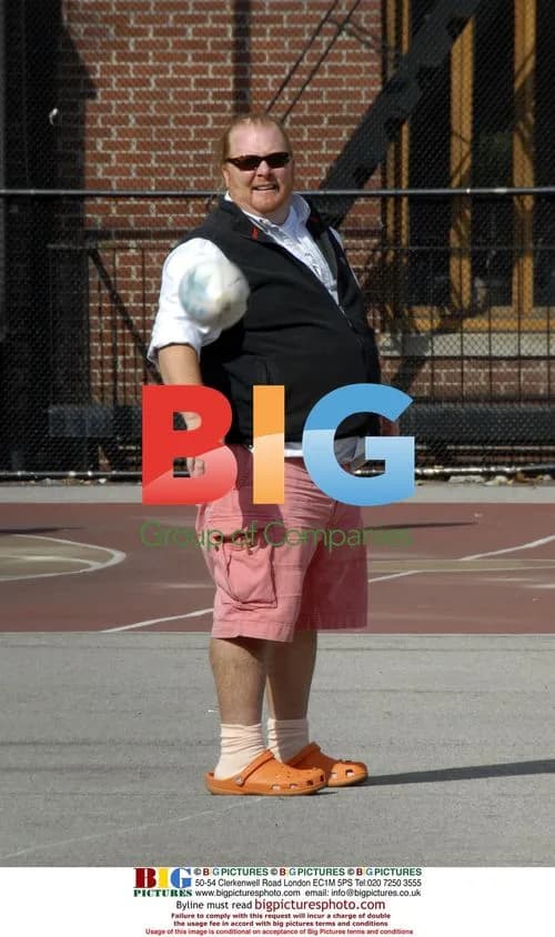 Chef Mario Batali playing football with kids