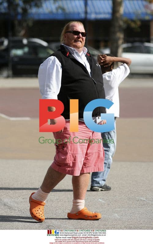 Chef Mario Batali plays touch football with kids