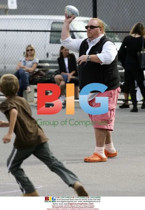 Mario Batali plays touch football with kids