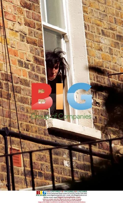 Amy Winehouse Receives Package Through Window