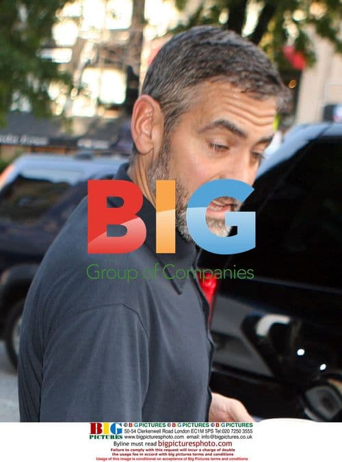 George Clooney Signing Autographs on Set
