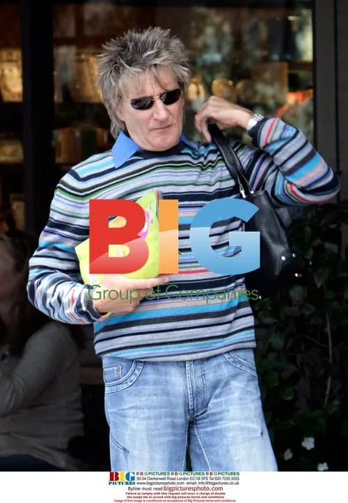 Rod Stewart Proudly Shows CBE Medal