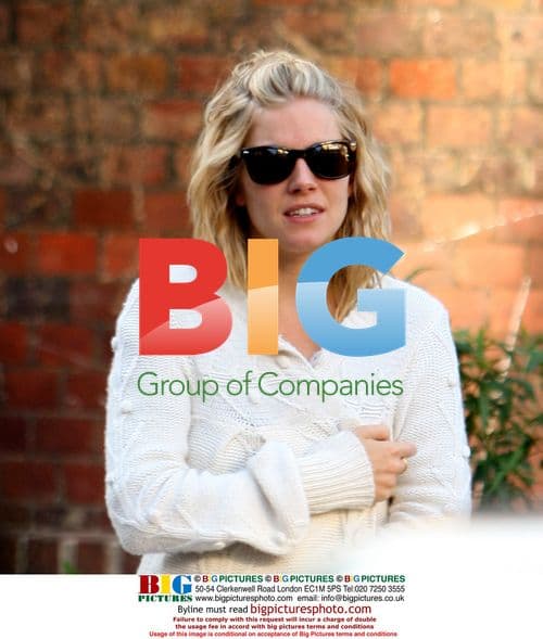 Sienna Miller taking dogs for walk in pajamas