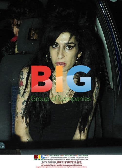 Amy Winehouse Leaves Home with Friends