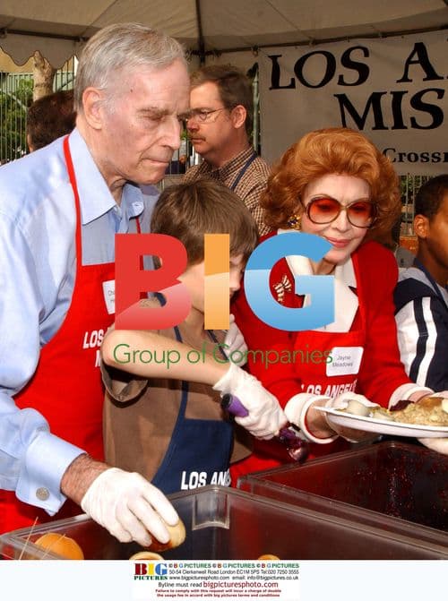 Charlton Heston serving Thanksgiving meal