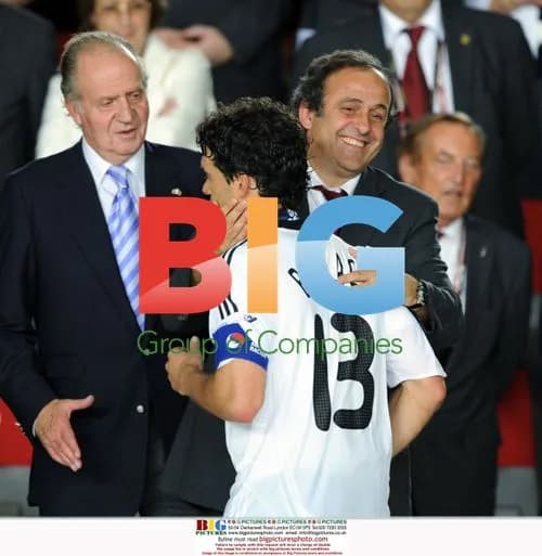 Dejected Michael Ballack with UEFA President Michel Platini