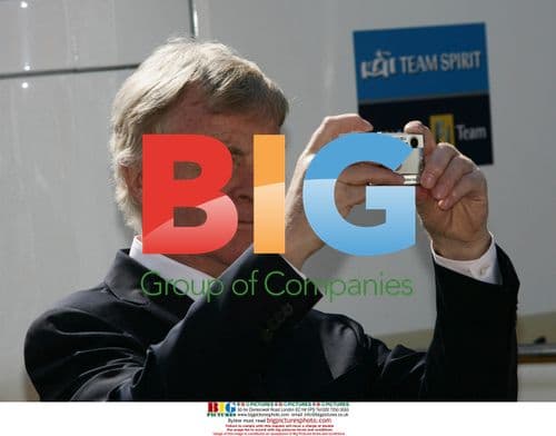 Max Mosley takes picture at Formula 1 race