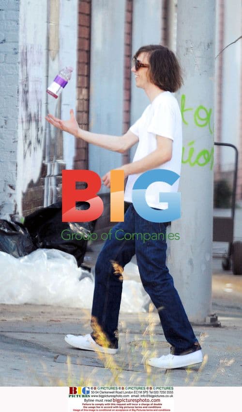 Musician Maxwell Drummey unloads equipment at rehearsal