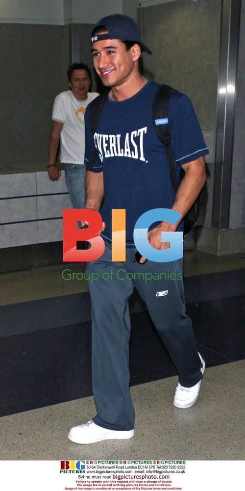 Cheerful Mario Lopez Arrives at LAX