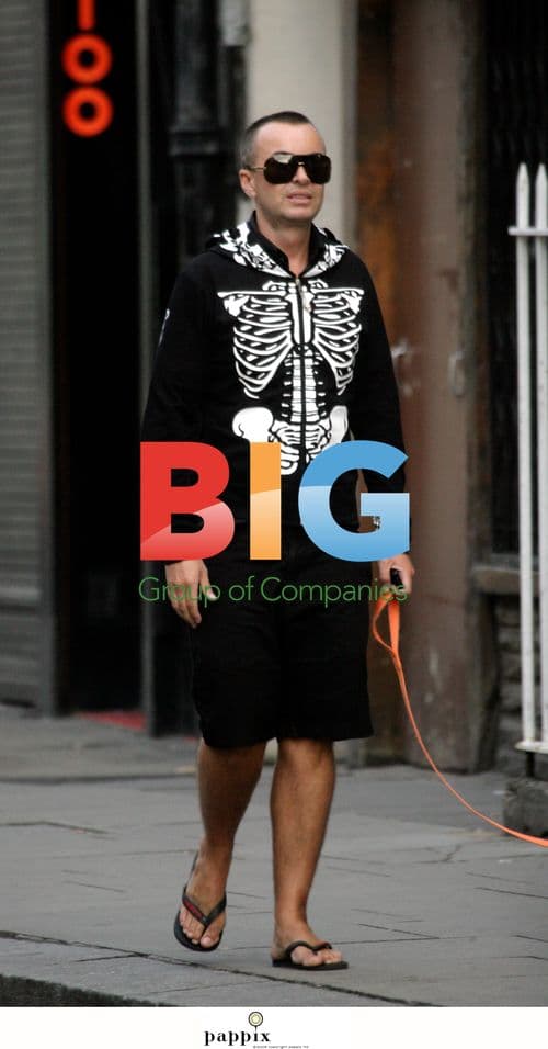 Julian MacDonald enjoys lunch with boyfriend and dog