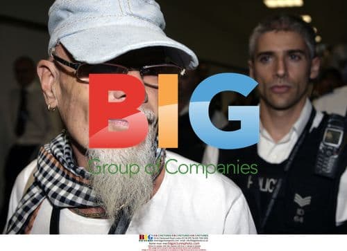 Gary Glitter arrives in UK after jail